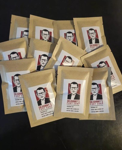 Bulk pack of thirteen 1 oz Dr. Johnny's Foot Soap packets in kraft paper packaging